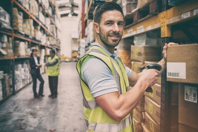 distribution center operator scanning inventory